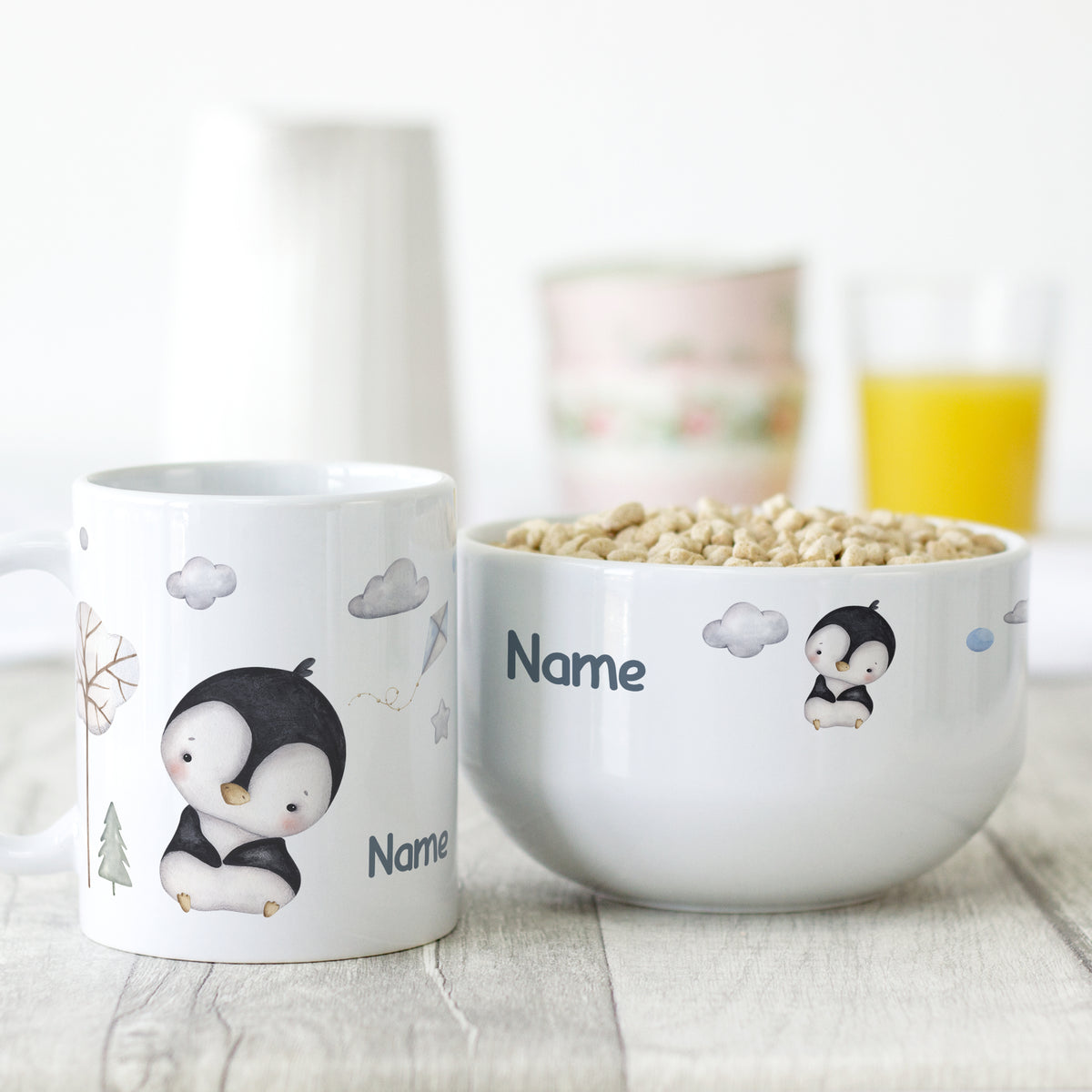 Tasse und Schüssel mit Pinguin-Motiv, personalisierbar.