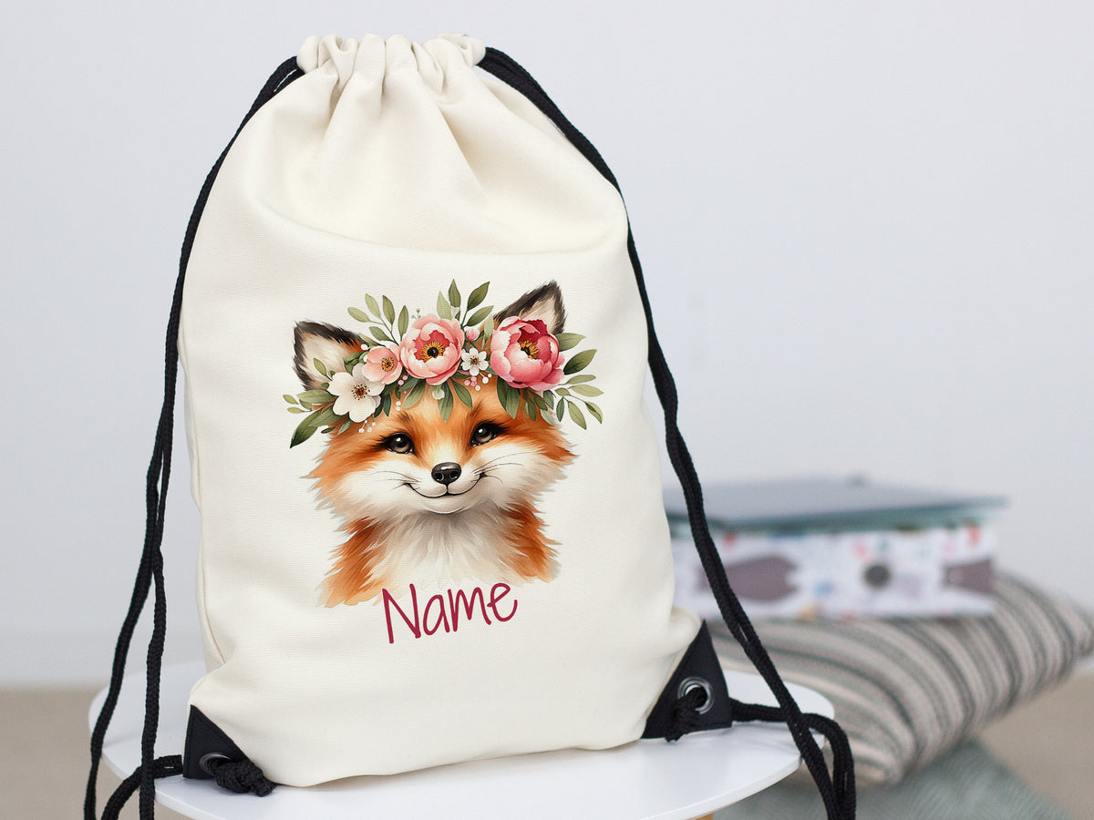 Beiger Turnbeutel mit Fuchs-Motiv und Blumenkranz.