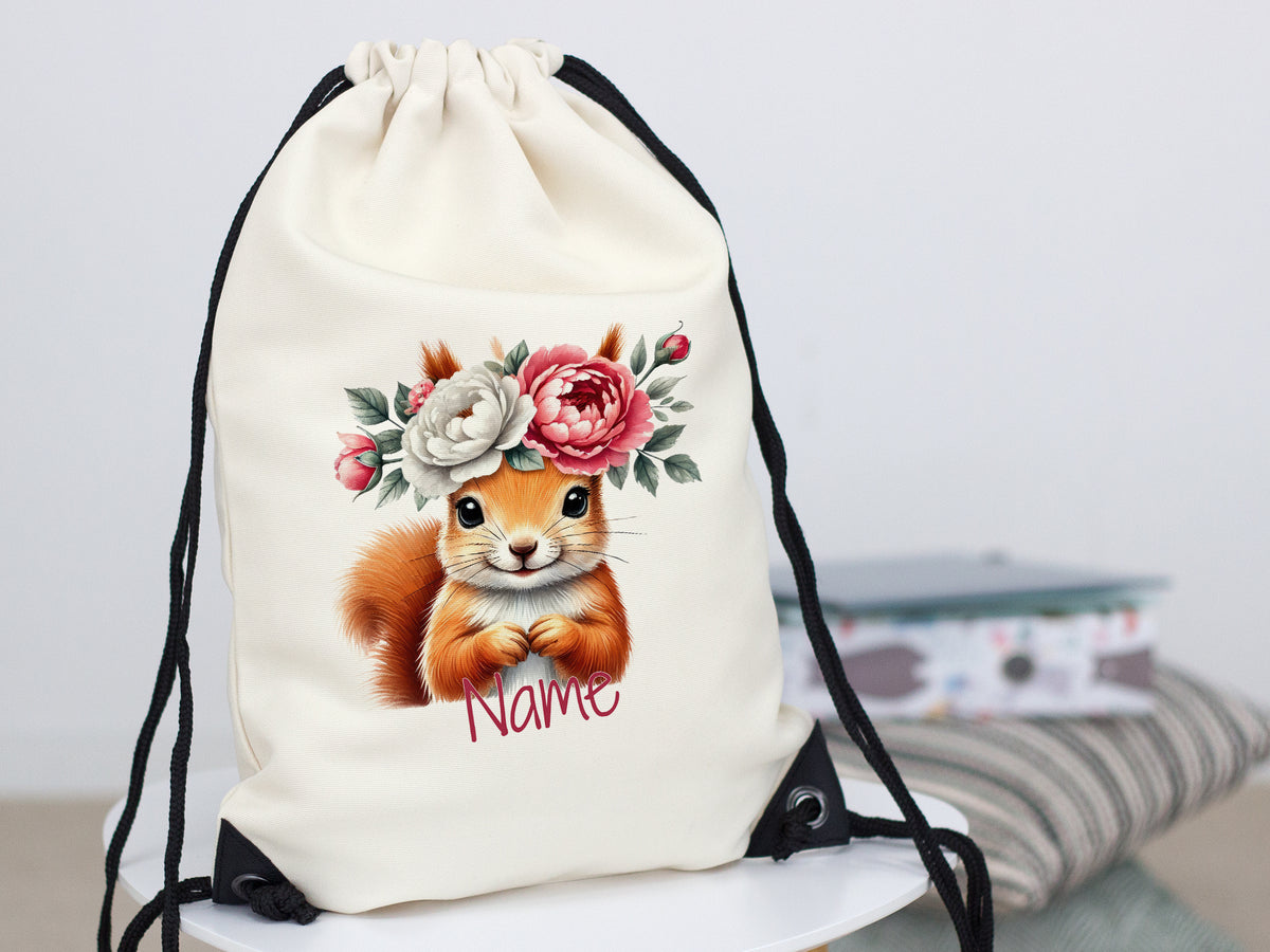 Beiger Rucksack mit Eichhörnchen und Blumenmotiv.