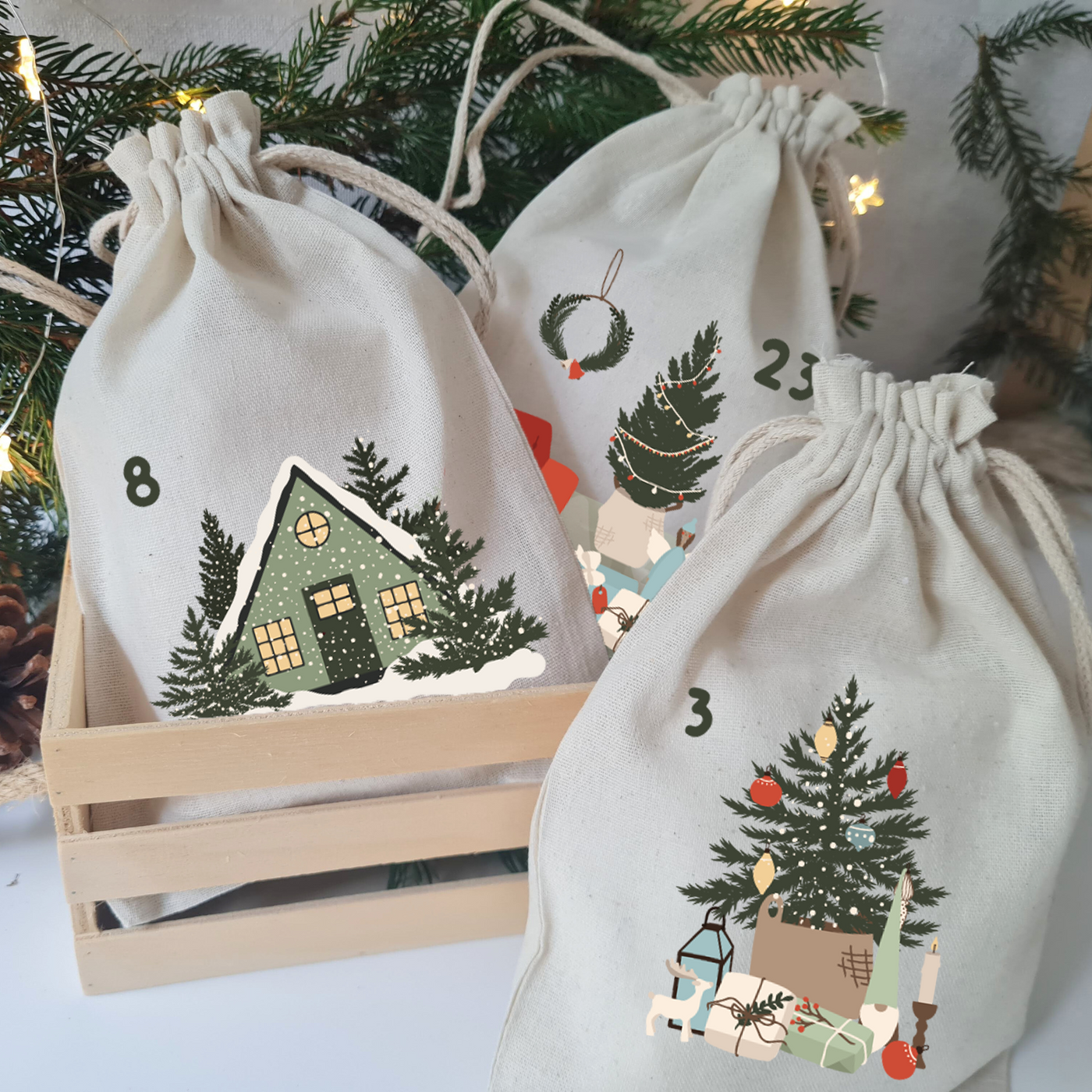 Mit Bügelbildern gestaltete Stoffbeutel für einen Adventskalender