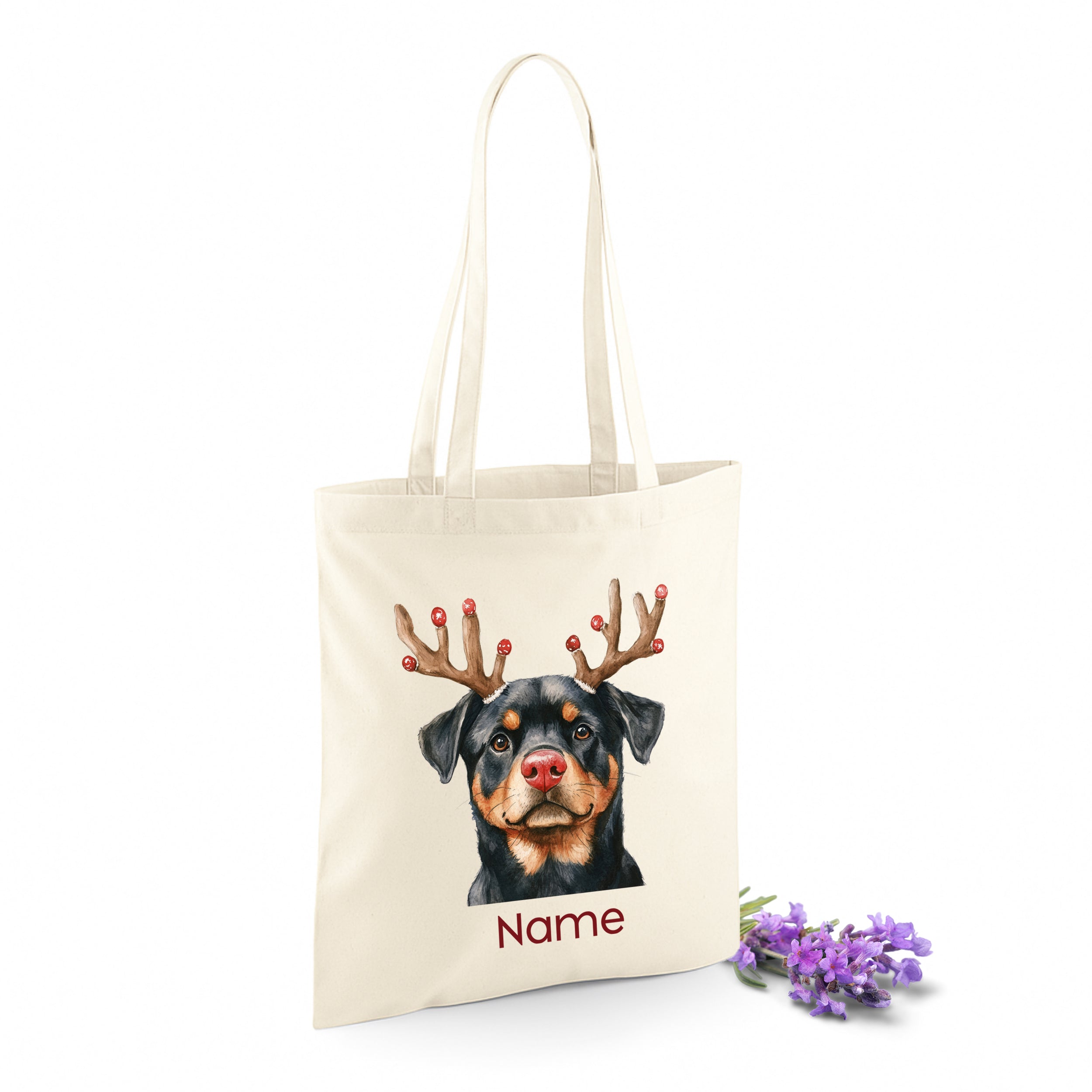 Beige Tragetasche mit Rottweiler und Geweih-Motiv.