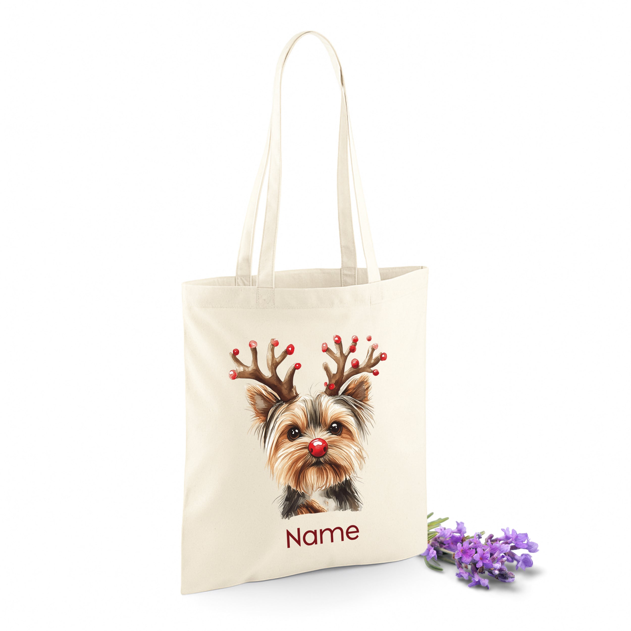 Beige Tragetasche mit Yorkshire Terrier und Weihnachtsdeko.