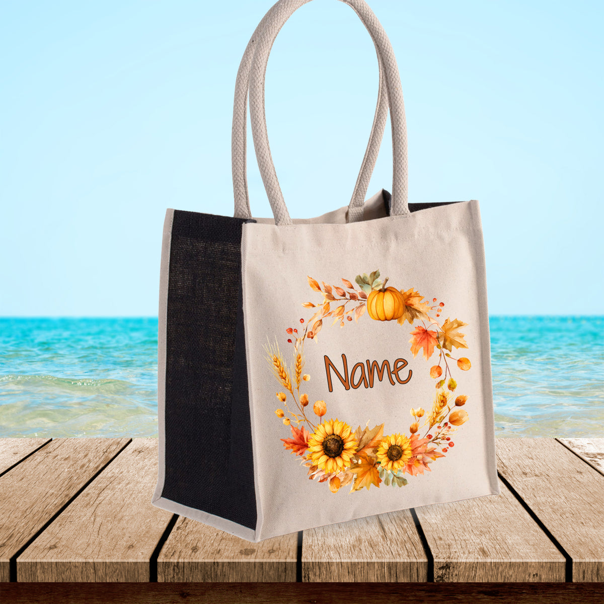 Beige Tragetasche mit herbstlichen Blumen und personalisierbarem Namen.