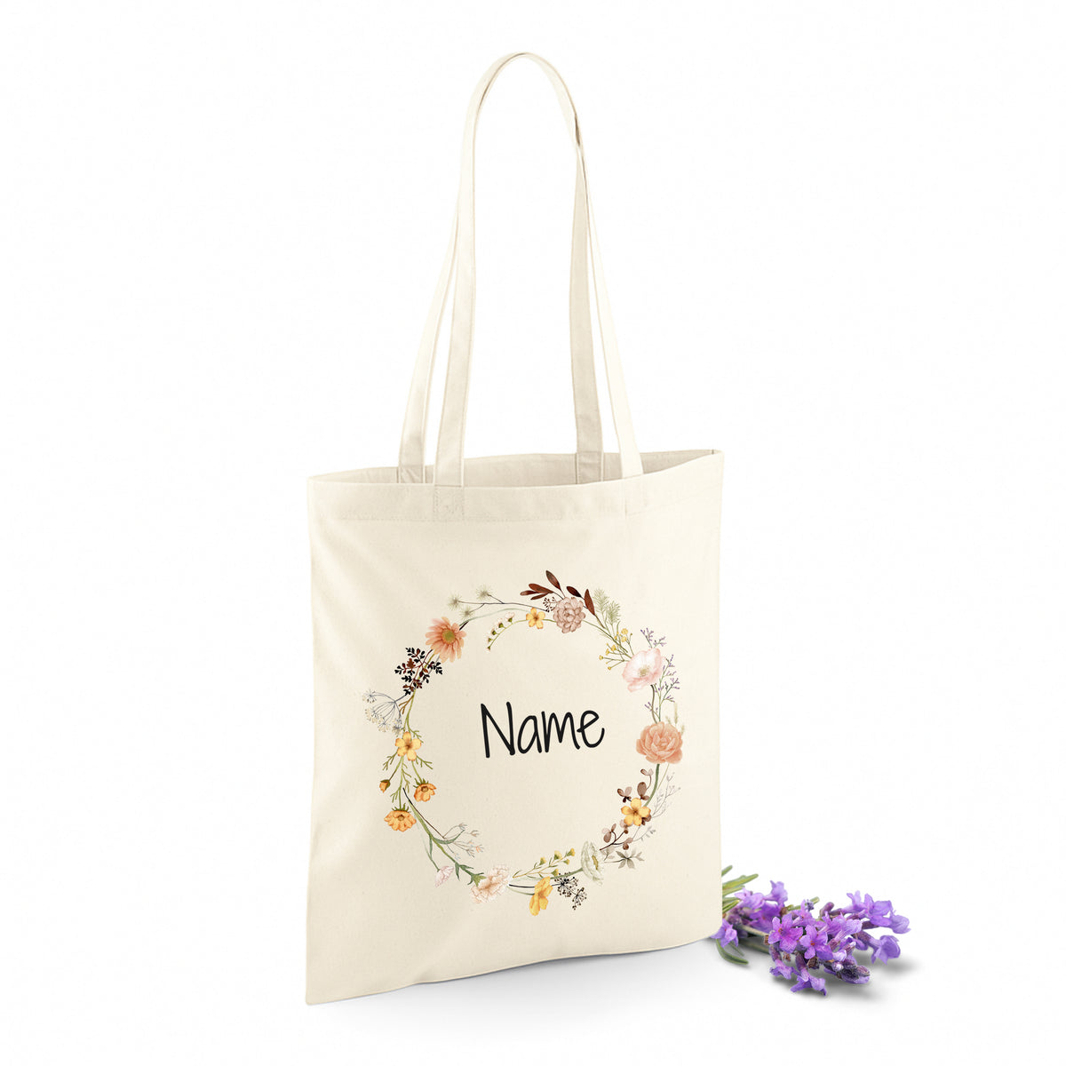 Beige Stofftasche mit floralem Muster und Platz für Namen.