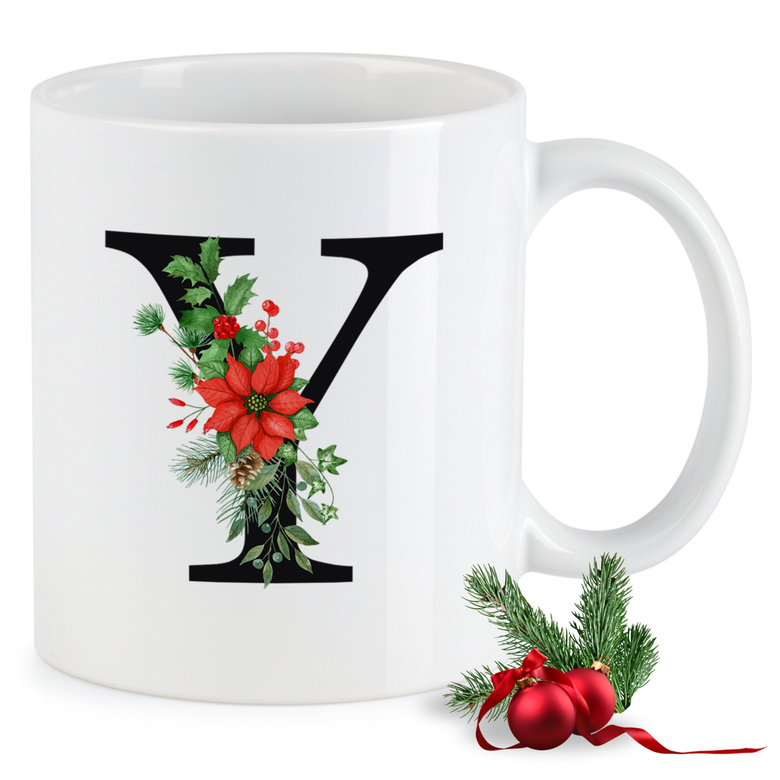 Weißer Becher mit floralem Buchstaben "Y" und Weihnachtsdeko.