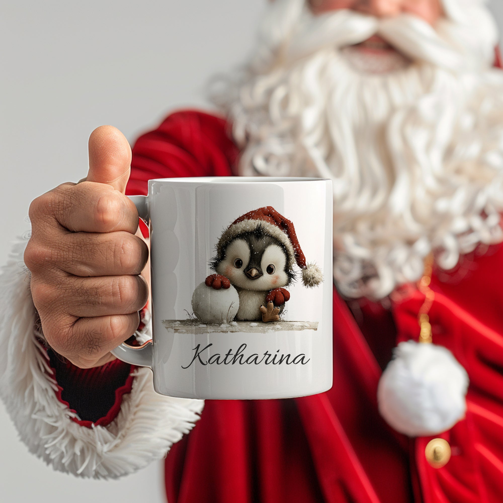 Tasse mit Pinguin-Motiv und Name "Katharina" in Weiß.