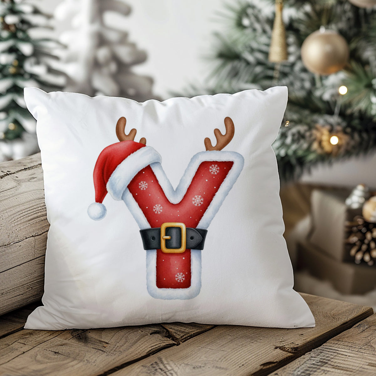 Weihnachtliches Kissen mit rotem Y, Geweih und Mütze.