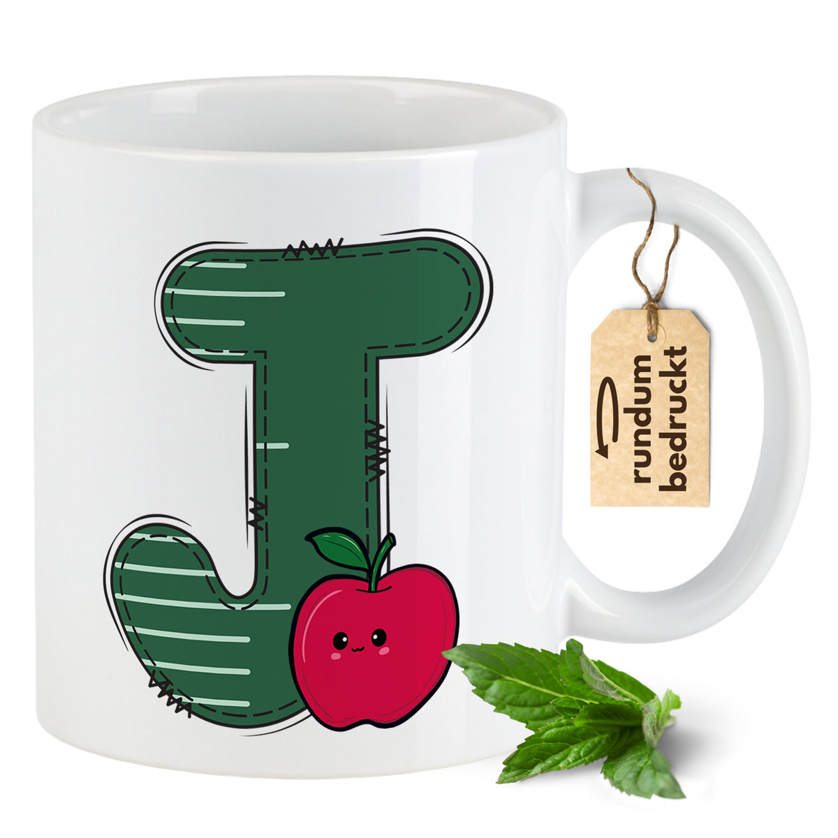 Weißer Kaffeebecher mit grünem "J" und rotem Apfel.