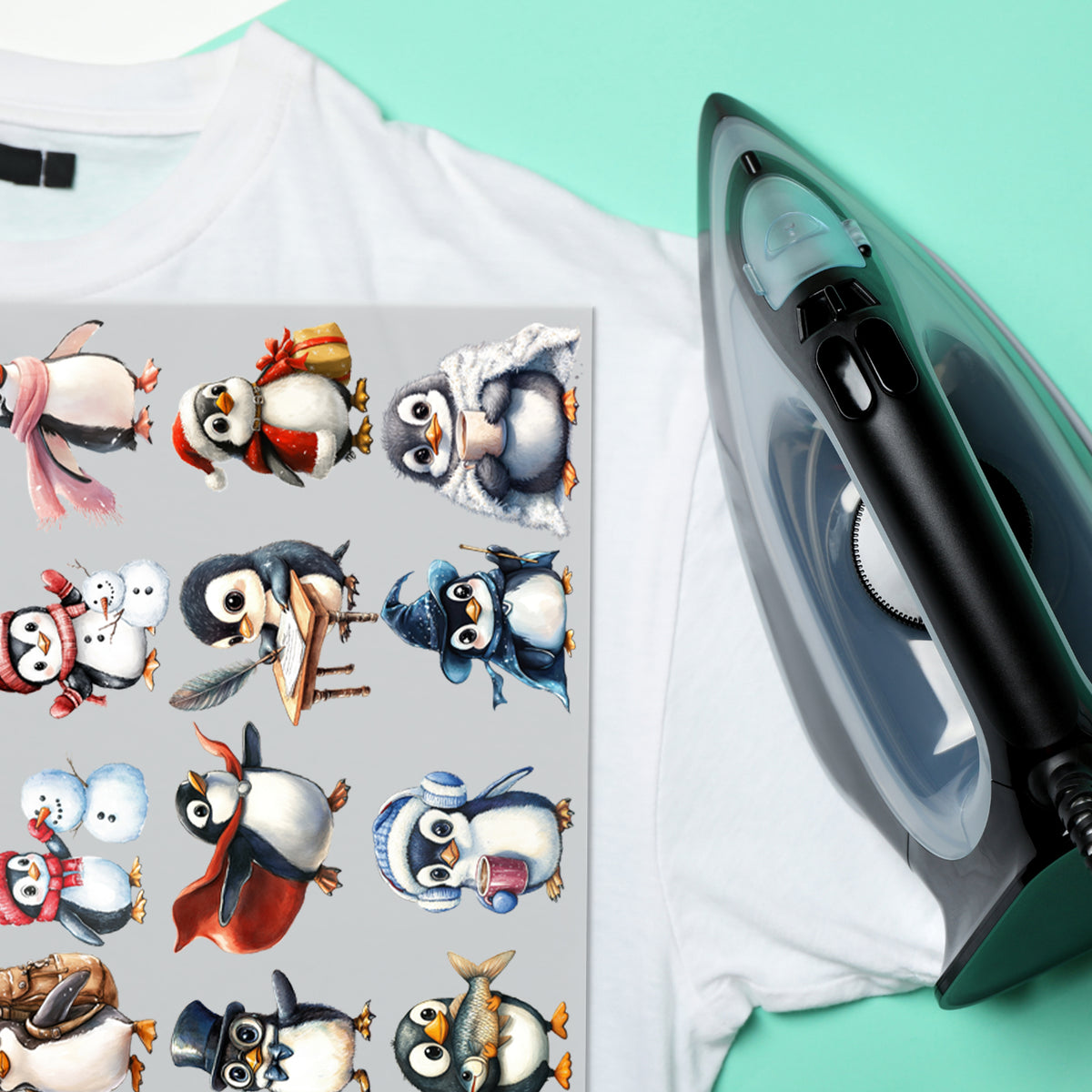 Pinguin-Bügelbilder auf weißem T-Shirt neben einem Bügeleisen