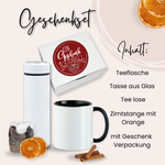 Geschenkset mit Teeflasche, Glas-Tasse, losem Tee und Zimt.