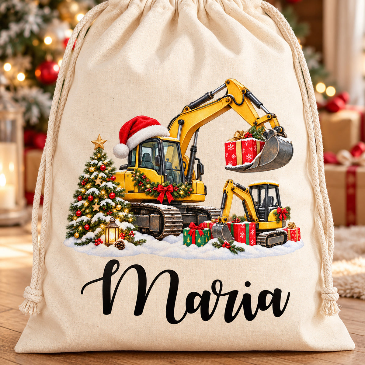 Detail des Baumwollsacks mit zwei weihnachtlichen Baggern, Geschenken, Tannenbaum und großem Wunschnamen.