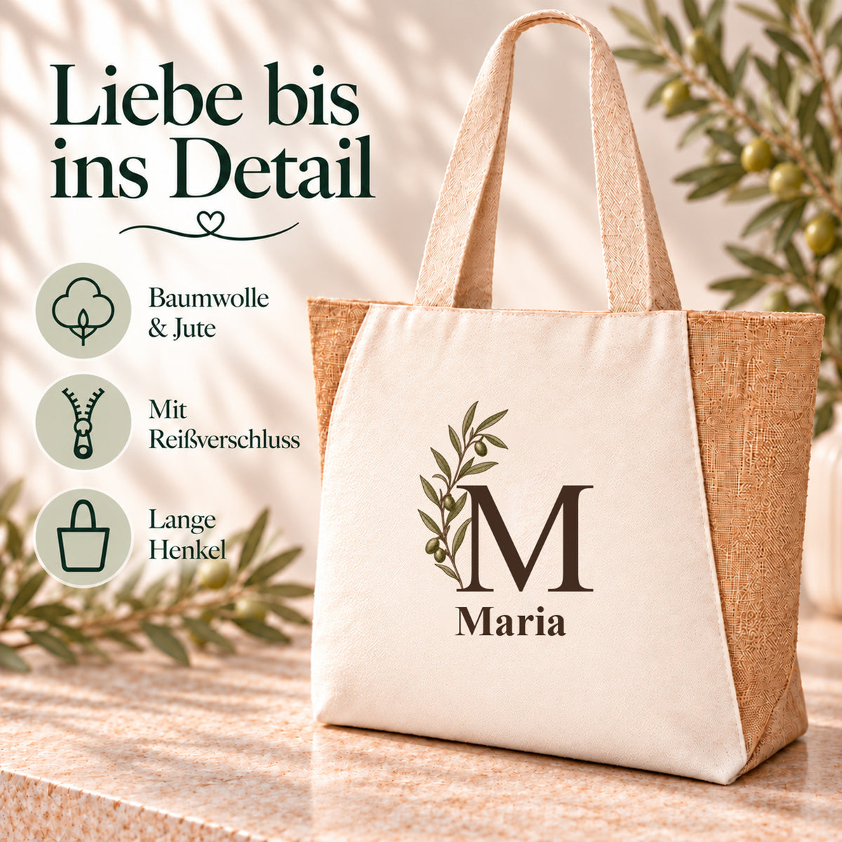 Shopper mit seitlicher Olivenranke und Angaben zu Baumwolle, Jute und Reißverschluss.